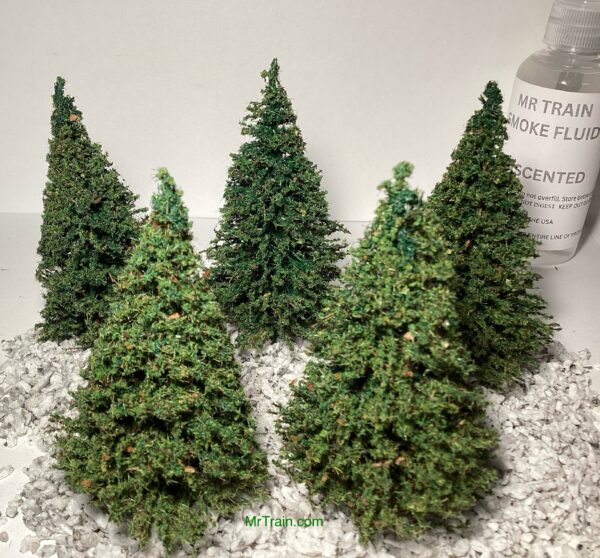 This pack of realistic miniature pine trees consists of five - 3 inch tall, flocked trees that are made in the USA at MrTrain.com.