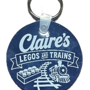 Free Keychain with purchase. Compliments of Claire's Legos & Trains.