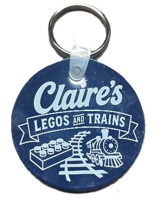 Free Keychain with purchase. Compliments of Claire's Legos & Trains.
